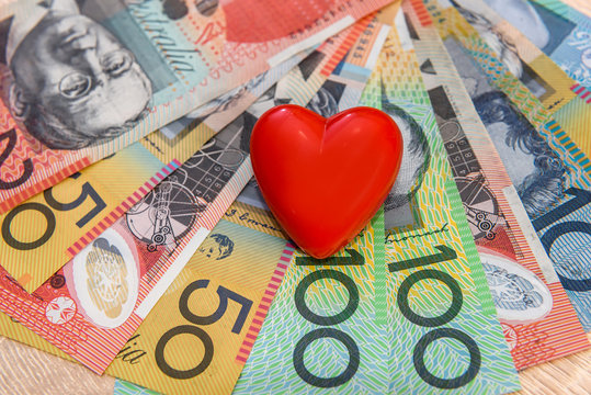 Healthcare cost. Australian dollars with red heart and pills in blister
