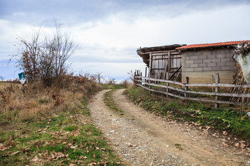 Rural road , countryside view, small village in Serbia.