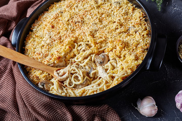 roasted turkey tetrazzini in a black dish