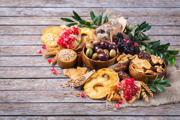 Tu Bishvat holiday symbols - dried fruits, pomegranate, barley, wheat