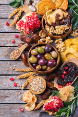 Tu Bishvat holiday symbols - dried fruits, pomegranate, barley, wheat