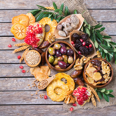 Tu Bishvat holiday symbols - dried fruits, pomegranate, barley, wheat