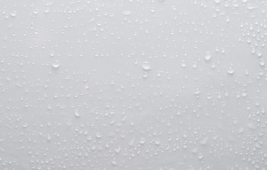 drops of water on a white surface