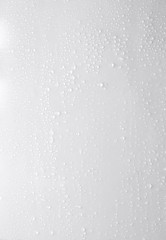 Naklejka na ściany i meble drops of water on a white surface
