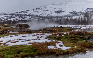 landscape full of snow with a house 