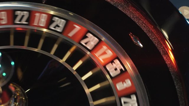 Ball spinning in roulette game in casino