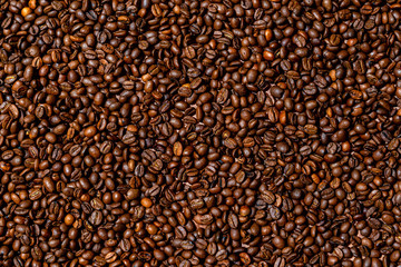 Close-up of brown, roasted coffee beans  background