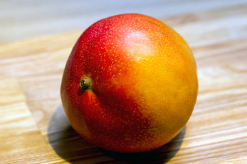still life of mango fruit in a grocery store window