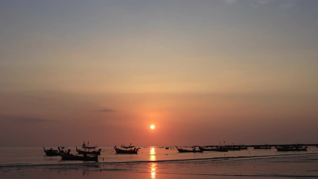 Time lapse video of fishing boats at sunset