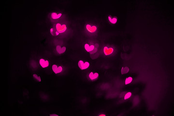 Pink hearts bokeh background. Valentine’s Day, symbol of love..