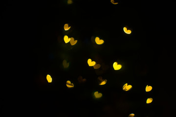 Yellow hearts bokeh background. Valentine’s Day, symbol of love.