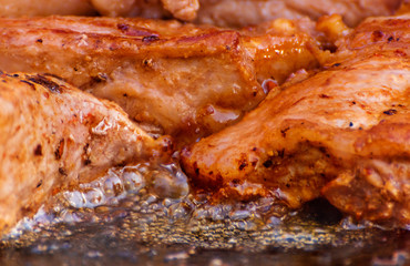 The meat is cooked in a cauldron