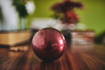 metal ball decorative on a elegant wooden table