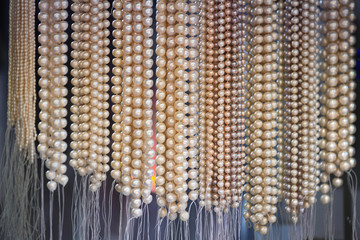 strings of beads from natural freshwater pearls in market