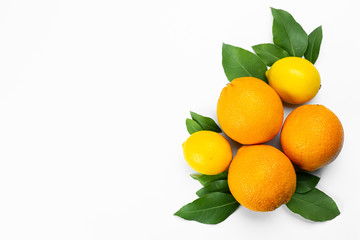 oranges and lemons on wooden table