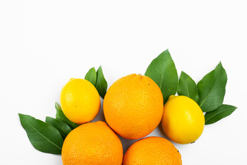 oranges and lemons on wooden table