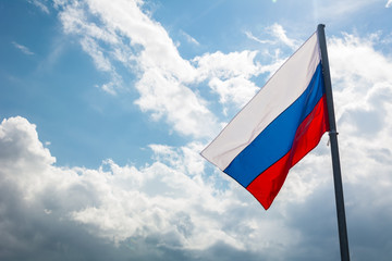 Russian flag on the beautiful sky