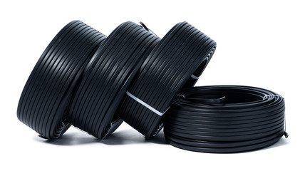 Coils of black  cable isolated on white background