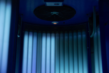 fan in vertical turbo solarium lamp in beauty salon