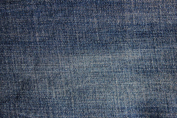 Denim jeans dark blue background. Empty old jeans fabric, aged unisex clothing detail, casual stylish jean material pattern, close up top view flat lay image