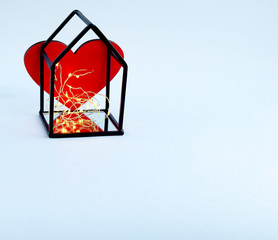 Red heart in mirror frame with backlight on white background