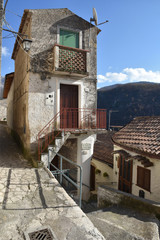 Prata Sannita, Italy, 01/13/2020. A narrow street between the old houses of a medieval village