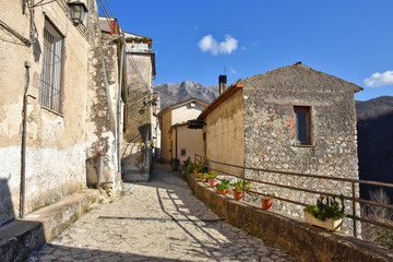 Fototapeta na wymiar Prata Sannita, Italy, 01/13/2020. A narrow street between the old houses of a medieval village
