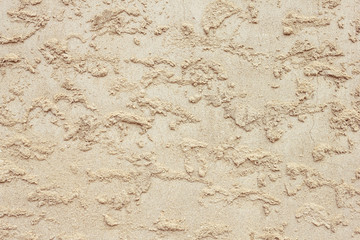 Stucco, cement on the wall.