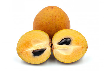 Whole and partial fresh sapodilla isolated on white background