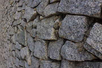 The texture of the masonry is made of rough stone.