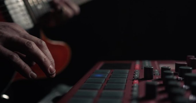Musician plays on sampler in action