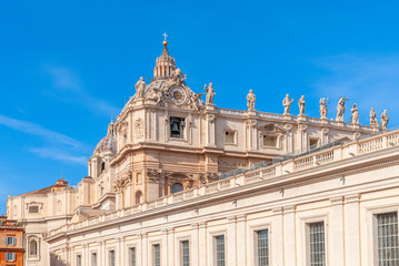 Obraz premium St Peter's Basilica on blue sky background. Vatican,