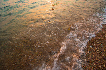 The beach by the sea in the evening