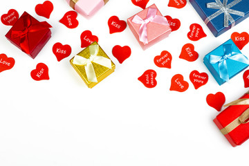 Little red hearts with romantic messages and difference color gift boxes on white background.