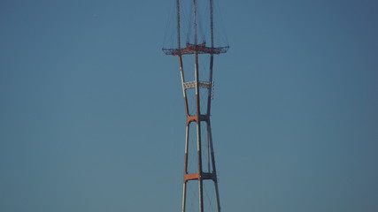 high voltage tower on background of blue sky