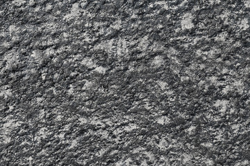 The surface. The asphalt is black.