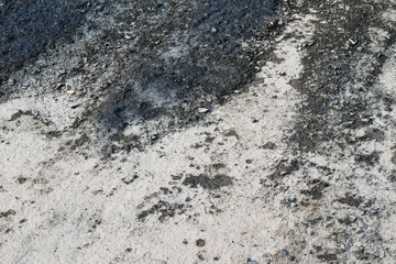 The surface. The asphalt is black.
