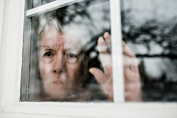 A sad lonely 70 years old senior in is apartment