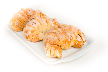 Crescent rolls of St. Martin on white ceramic plate.