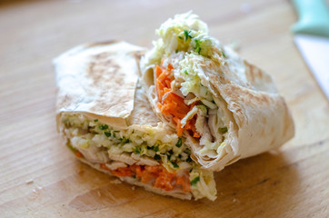 homemade shawarma with cabbage, carrot and chicken, close up. proper nutrition healthy food