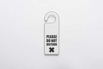 top view of please do no disturb sign on white background