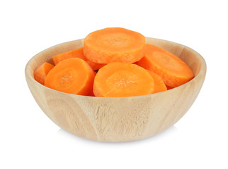 Peeled carrots, sliced into pieces in a wooden bowl isolated on white background.