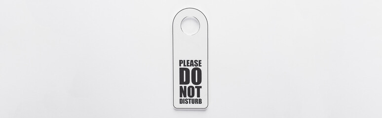 top view of please do no disturb sign on white background, panoramic shot
