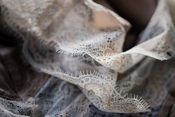 Delicate pastel silk lace lingerie, light-shading background - obrazy, fototapety, plakaty
