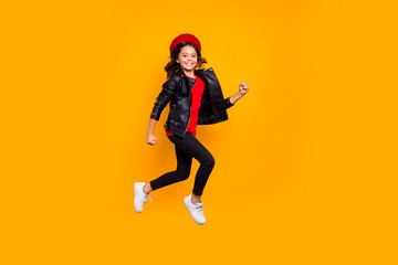 Fototapeta na wymiar Full length body size view of her she nice attractive pretty trendy cheerful cheery funky long-haired girl jumping strolling having fun isolated over bright vivid shine vibrant yellow color background