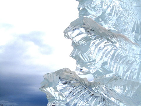 Ice figure in the form of a fir tree carved against the sky