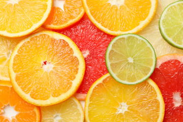 Citrus fruits slices texture background, close up