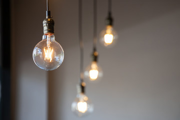 vintage light bulb hanging from ceiling for decoration in living room. - Powered by Adobe