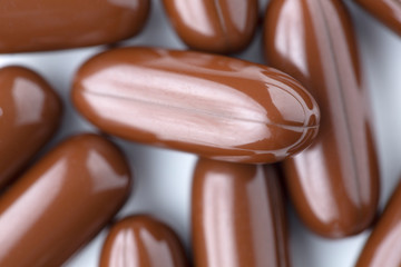 Pills tablets vitamins drugs brown close up macro shot