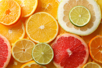 Fresh citrus fruits slices texture background, close up